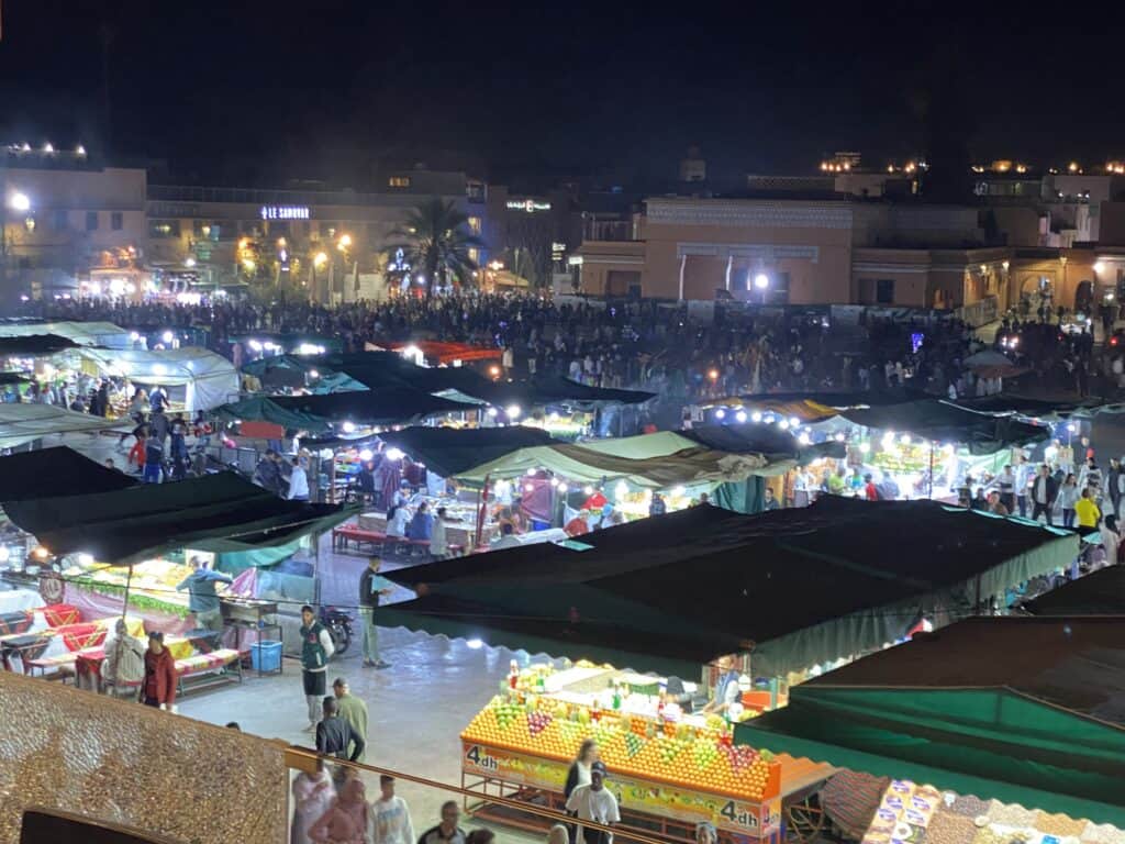 Night view of market stalls from above in Jemma El Fnaa square in Marrakech Morocco