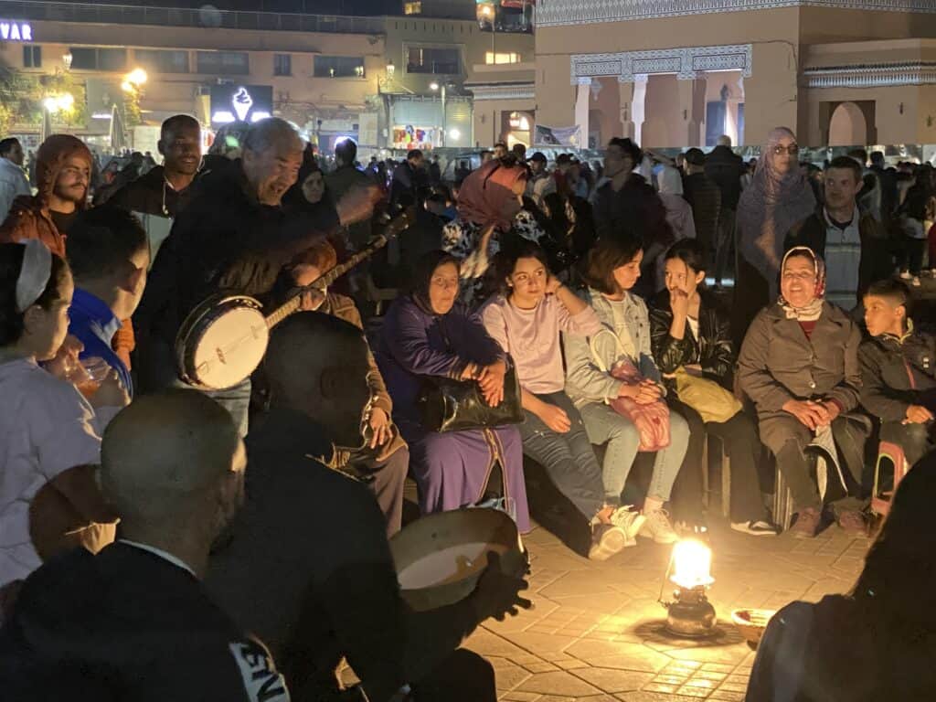 Marrakech storytellers at night in Jemma El Fnaa square