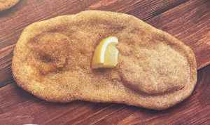 Beaver tail pastry bread with sugar and a lemon on top