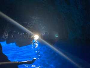 Blue Grotto in Capri Italy with light shining from small entrance to cave