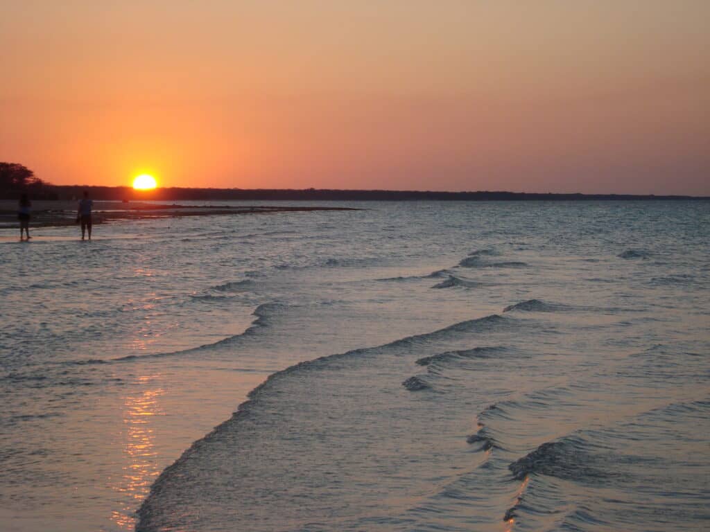 Sunset on Cuba beach with waves lapping the shore