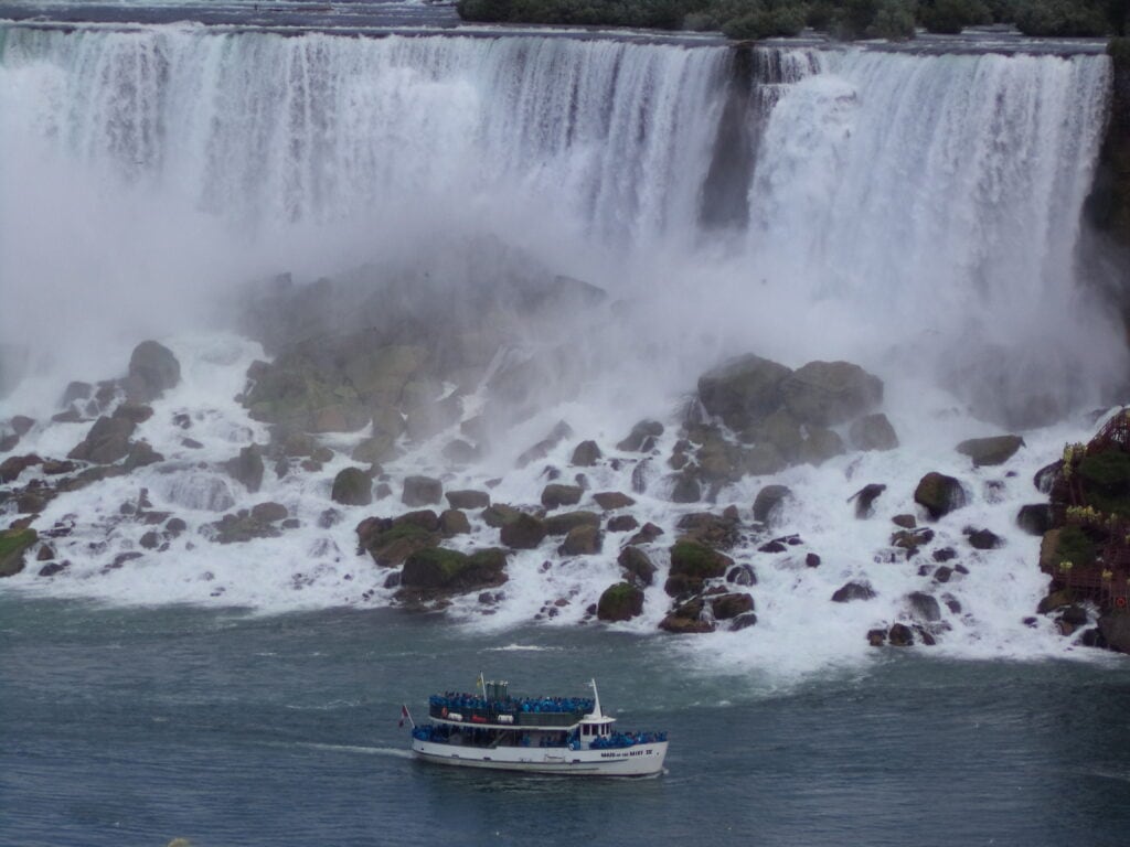 Niagara Falls in Ontario Canada with Maid of the Mist boat crossing the lake in front